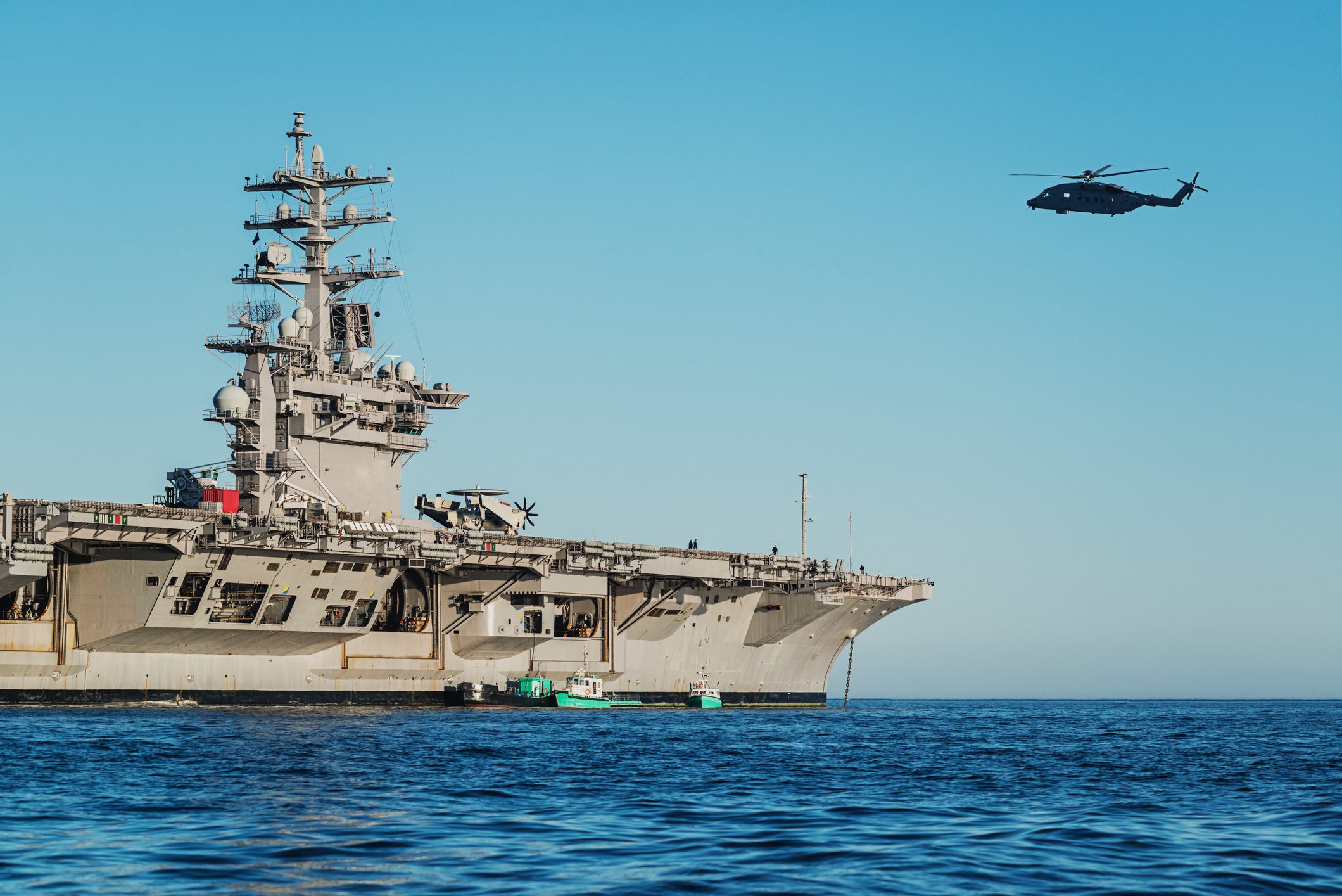 Naval ship at sea with helicopter