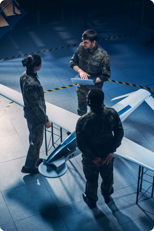Soldiers analyzing unmanned aerial vehicle